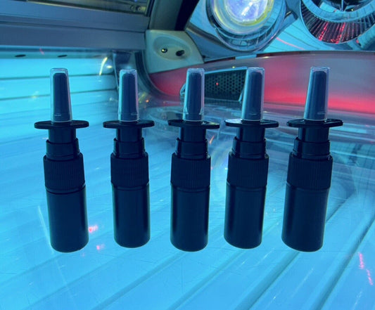 4  kandytan  unbranded nasal tanning spray  for resellers pictured on sunbed